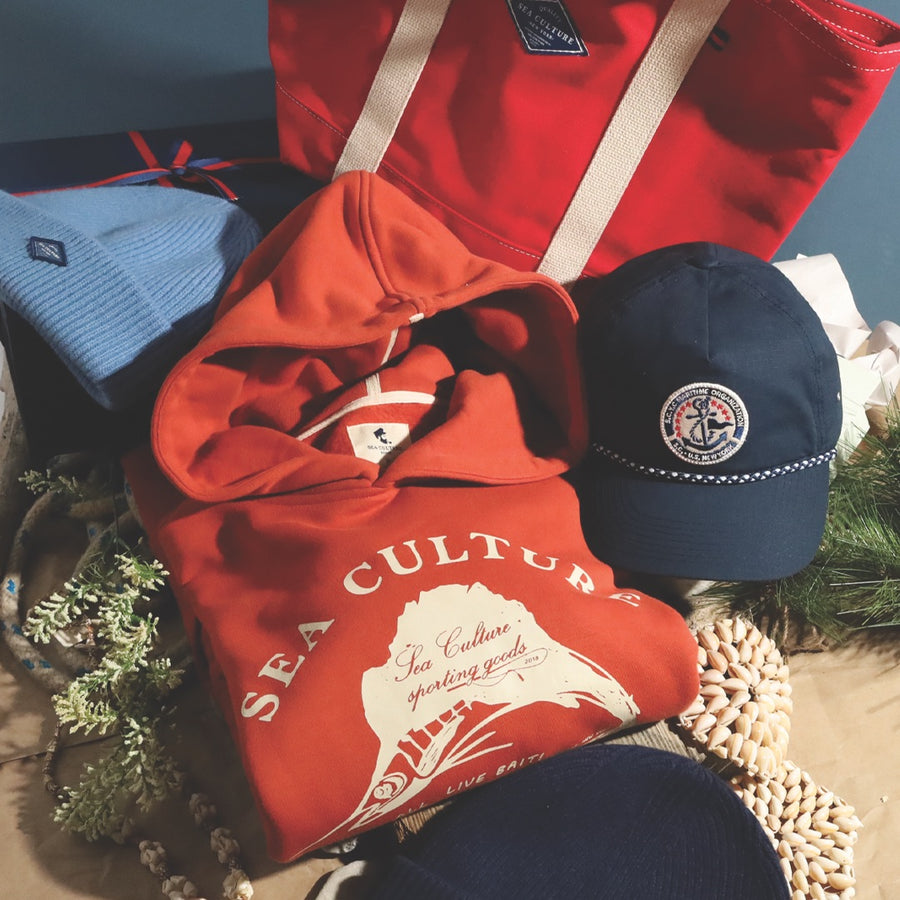 Red Sea Culture hoodie and tote with navy cap and blue beanie