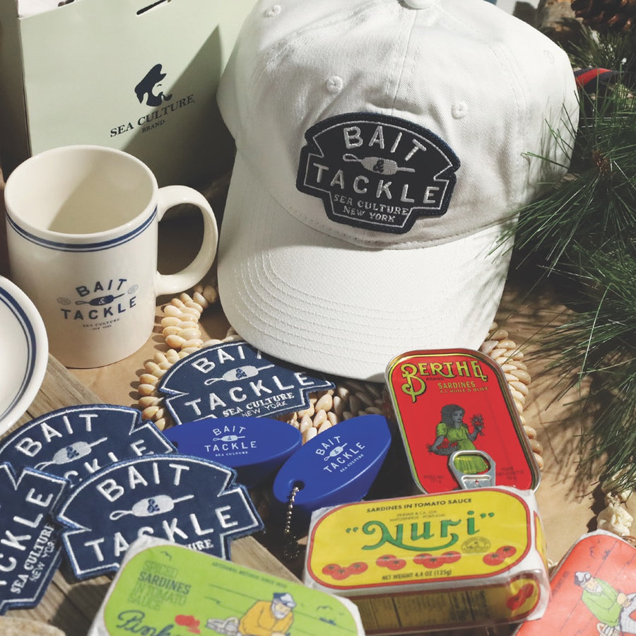 Bait and Tackle cap, coffee mug, patches, key floats and tinned fish